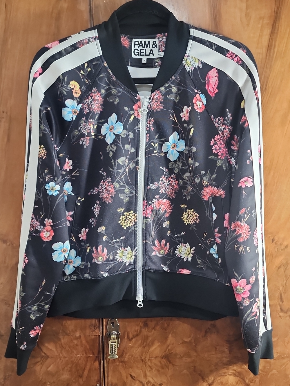 Pam & Gela Black Floral Bomber Track Jacket with White Stripe Accents